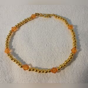 NWT Handcrafted Elegant 9" Gold and Fire Orange Beaded Bracelet.